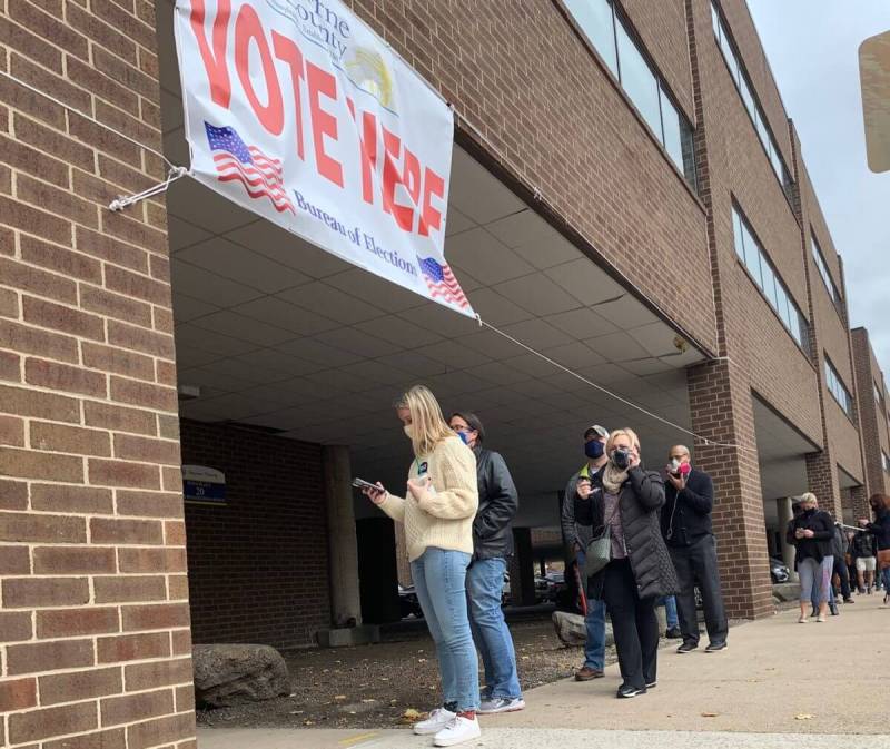 Voters wait in line on Tuesday