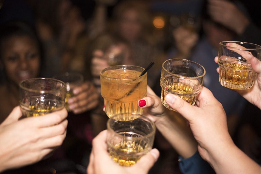 A group of girls having a "cheers" with their highball cocktails