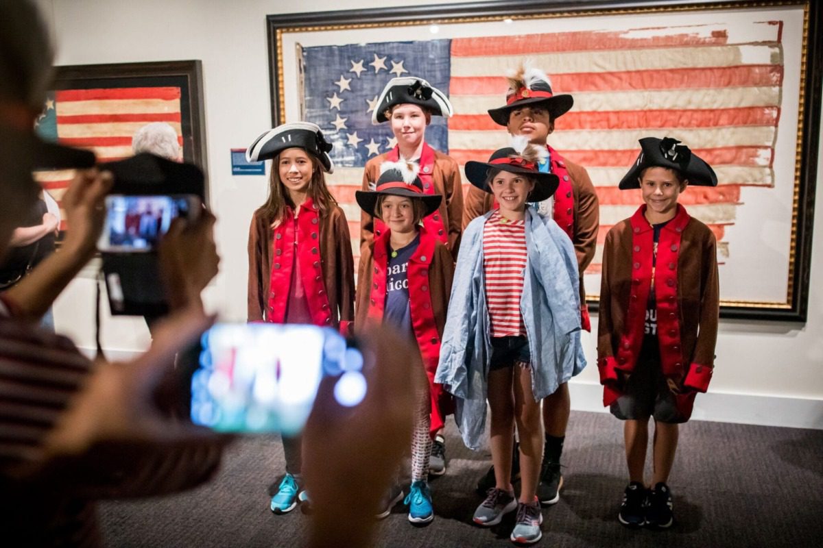 a family inside the museum of the american revolution